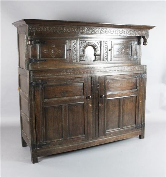 A 17th century oak court cupboard, W.5ft 8in. D.1ft 11in. H.5ft 1in.